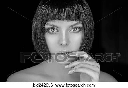 Stock Photograph - Portrait of serious Caucasian woman. Fotosearch