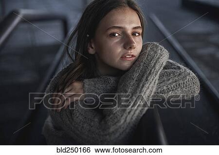 Portrait of serious Caucasian woman leaning on staircase railing View Large Photo Image Stock Photograph - Portrait of serious Caucasian woman leaning on staircase railing. Fotosearch