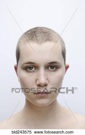 Portrait of serious Caucasian woman with shaved-head View Large Photo Image Stock Photography - Portrait of serious Caucasian woman with shaved-head. Fotosearch