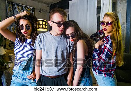 Portrait of serious fashionable Caucasian friends View Large Photo Image Stock Photo - Portrait of serious fashionable Caucasian friends. Fotosearch