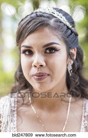 Stock Photo - Portrait of serious Hispanic girl. Fotosearch