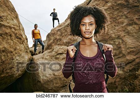 Portrait of serious woman posing near rock formation View Large Photo Image Stock Photo - Portrait of serious woman posing near rock formation. Fotosearch
