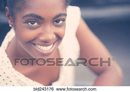 Stock Photograph - Portrait of smiling African American woman. Fotosearch