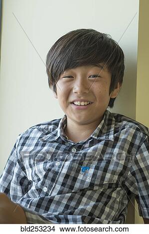 Portrait of smiling Asian boy View Large Photo Image Picture - Portrait of smiling Asian boy. Fotosearch