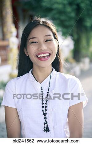 Portrait of smiling Asian woman View Large Photo Image Stock Image - Portrait of smiling Asian woman. Fotosearch