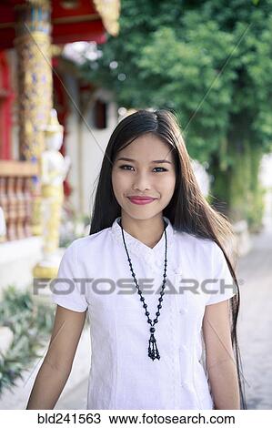 Stock Image - Portrait of smiling Asian woman. Fotosearch