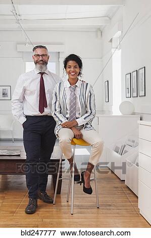 Portrait of smiling businessman and businesswoman View Large Photo Image Stock Photo - Portrait of smiling businessman and businesswoman. Fotosearch