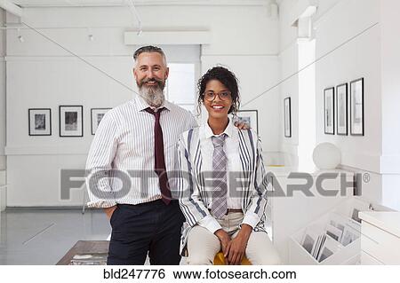 Portrait of smiling businessman and businesswoman View Large Photo Image Stock Photograph - Portrait of smiling businessman and businesswoman. Fotosearch