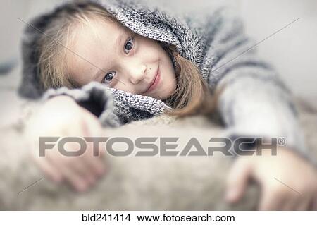 Portrait of smiling Caucasian girl wearing sweater View Large Photo Image Picture - Portrait of smiling Caucasian girl wearing sweater. Fotosearch