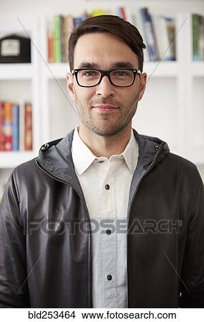 Picture - Portrait of smiling Caucasian man wearing jacket and eyeglasses. Fotosearch