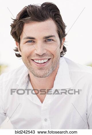 Stock Image - Portrait of smiling Caucasian man. Fotosearch