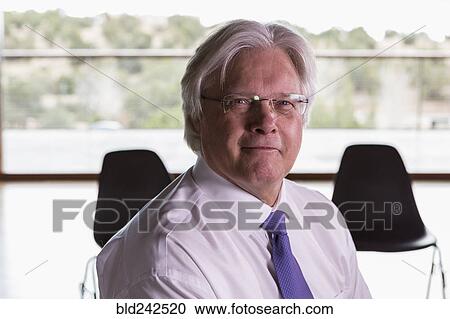 Portrait of smiling Caucasian businessman View Large Photo Image Stock Image - Portrait of smiling Caucasian businessman. Fotosearch