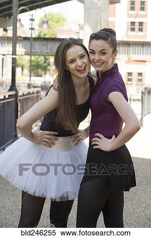 Portrait of smiling Caucasian ballerinas standing outdoors View Large Photo Image Stock Photography - Portrait of smiling Caucasian ballerinas standing outdoors. Fotosearch