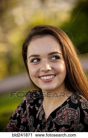 Stock Image - Portrait of smiling Caucasian teenage girl. Fotosearch