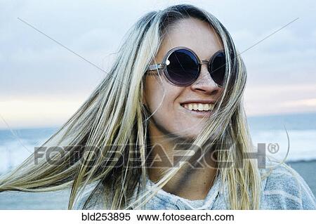 Portrait of smiling Caucasian woman at beach View Large Photo Image Stock Photography - Portrait of smiling Caucasian woman at beach. Fotosearch