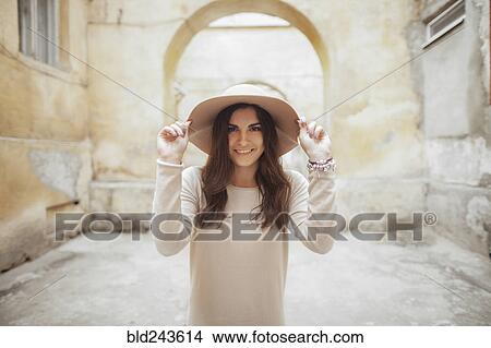 Picture - Portrait of smiling Caucasian woman wearing hat. Fotosearch