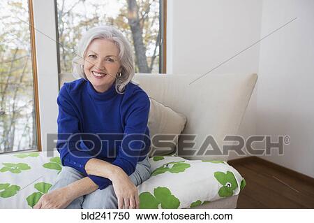 Stock Image - Portrait of smiling Caucasian woman. Fotosearch