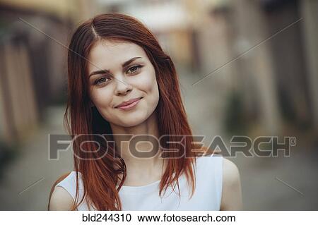 Stock Image - Portrait of smiling Caucasian woman. Fotosearch