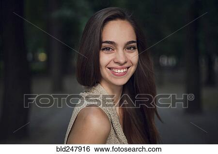 Stock Photograph - Portrait of smiling Caucasian woman. Fotosearch