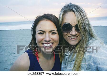 Portrait of smiling Caucasian women at beach View Large Photo Image Stock Photo - Portrait of smiling Caucasian women at beach. Fotosearch
