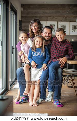 Stock Photo - Portrait of smiling family. Fotosearch
