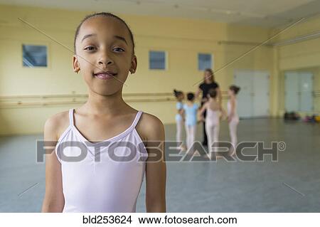 Picture - Portrait of smiling girl in ballet studio. Fotosearch