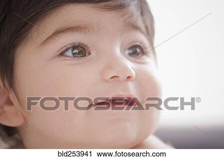 Stock Image - Portrait of smiling Hispanic baby boy. Fotosearch