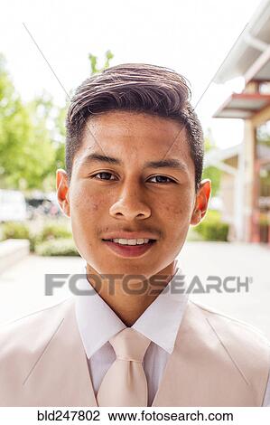 Stock Image - Portrait of smiling Hispanic boy. Fotosearch