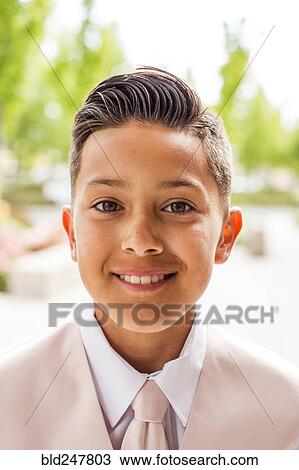 Stock Image - Portrait of smiling Hispanic boy. Fotosearch