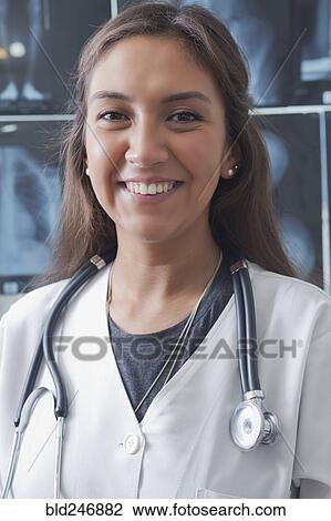 Portrait of smiling Hispanic doctor View Large Photo Image Stock Image - Portrait of smiling Hispanic doctor. Fotosearch