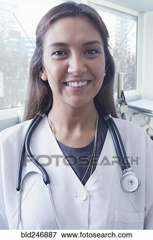 Portrait of smiling Hispanic doctor View Large Photo Image Stock Photo - Portrait of smiling Hispanic doctor. Fotosearch