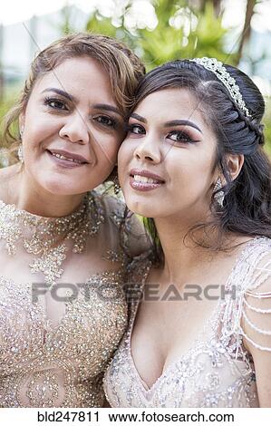 Portrait of smiling Hispanic mother and daughter View Large Photo Image Stock Image - Portrait of smiling Hispanic mother and daughter. Fotosearch
