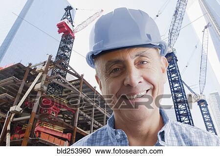 Portrait of smiling Hispanic construction worker View Large Photo Image Stock Image - Portrait of smiling Hispanic construction worker. Fotosearch