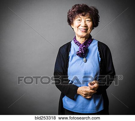 Stock Photo - Portrait of smiling Japanese woman. Fotosearch