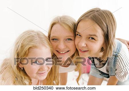 Portrait of smiling Middle Eastern sisters cheek to cheek View Large Photo Image Stock Image - Portrait of smiling Middle Eastern sisters cheek to cheek. Fotosearch