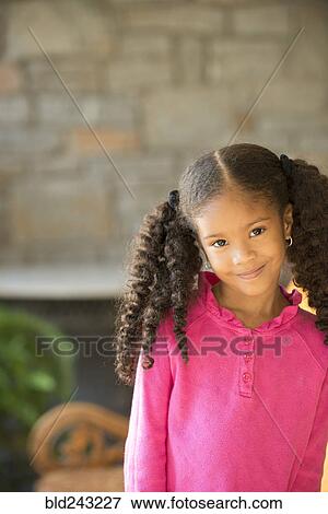 Portrait of smiling Mixed Race girl View Large Photo Image Stock Photo - Portrait of smiling Mixed Race girl. Fotosearch