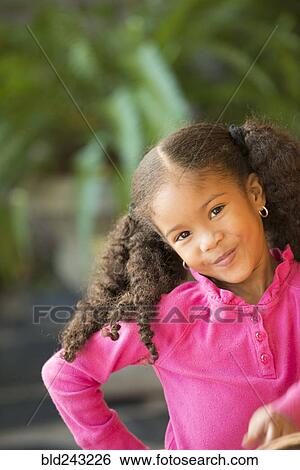Portrait of smiling Mixed Race girl View Large Photo Image Stock Photograph - Portrait of smiling Mixed Race girl. Fotosearch