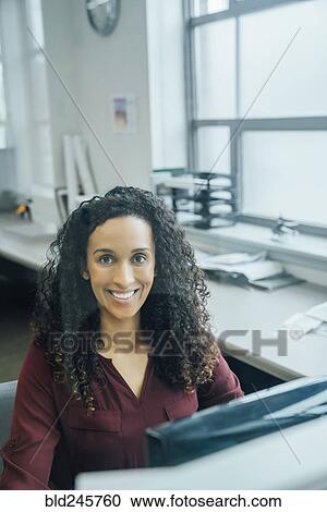 Portrait of smiling mixed race businesswoman View Large Photo Image Stock Image - Portrait of smiling mixed race businesswoman. Fotosearch