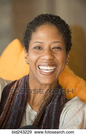 Stock Photo - Portrait of smiling Mixed Race woman. Fotosearch