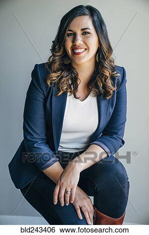 Stock Photograph - Portrait of smiling Mixed Race woman. Fotosearch