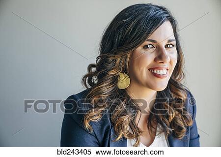Stock Photography - Portrait of smiling Mixed Race woman. Fotosearch
