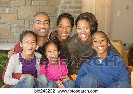 Stock Image - Portrait of smiling multi-ethnic family. Fotosearch