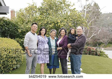 Stock Photo - Portrait of smiling multi-generation family. Fotosearch