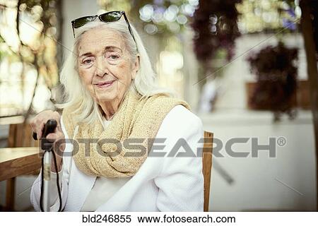 Stock Photography - Portrait of smiling older Caucasian woman wearing scarf. Fotosearch