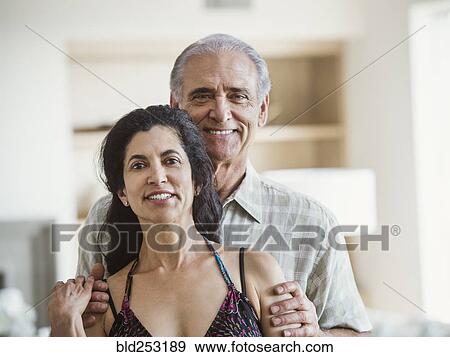 Stock Photo - Portrait of smiling older couple. Fotosearch