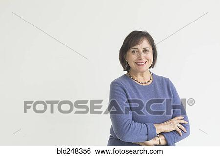 Stock Photograph - Portrait of smiling older Mixed Race woman. Fotosearch