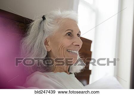 Portrait of smiling older woman View Large Photo Image Stock Photo - Portrait of smiling older woman. Fotosearch