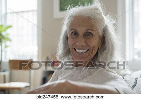 Stock Photograph - Portrait of smiling older woman. Fotosearch
