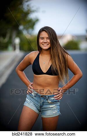 Portrait of smiling Pacific Islander girl wearing bikini in street View Large Photo Image Stock Photo - Portrait of smiling Pacific Islander girl wearing bikini in street. Fotosearch