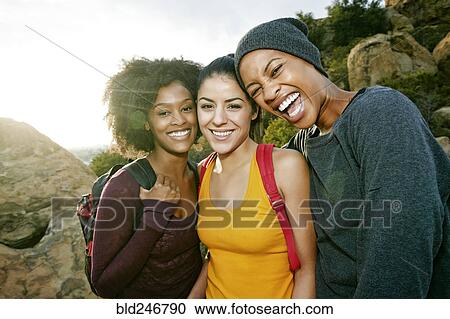 Portrait of smiling women hiking View Large Photo Image Stock Image - Portrait of smiling women hiking. Fotosearch